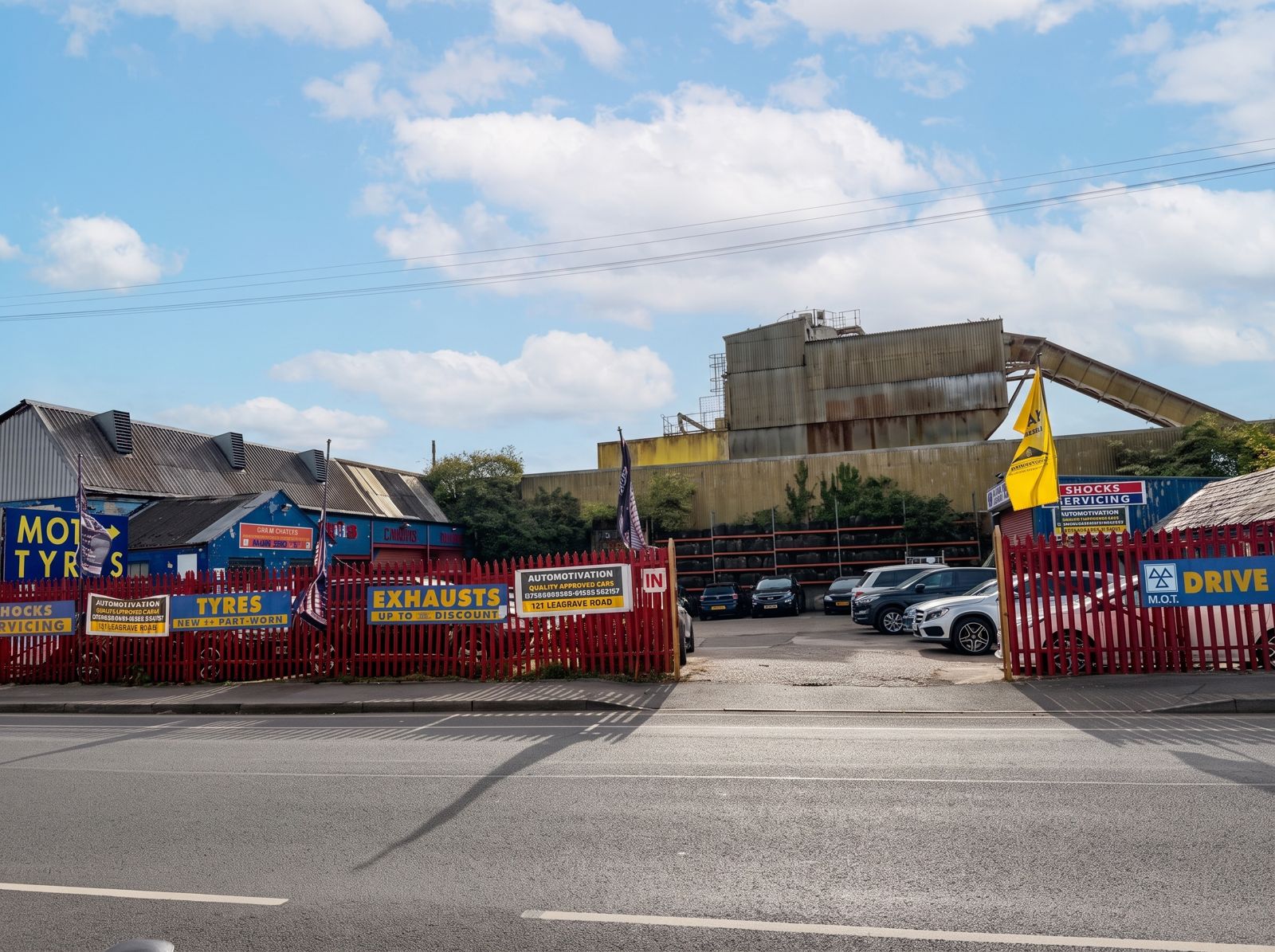 The DriveRyte entrance on Leagrave Road, behind the red fence